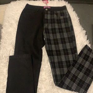 Boot cut jeans. One leg is all black other leg is grey black plaid